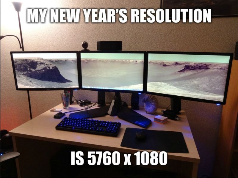 A picture of a three-monitor computer display labelled "My New Year's resolution is 5760x1080"