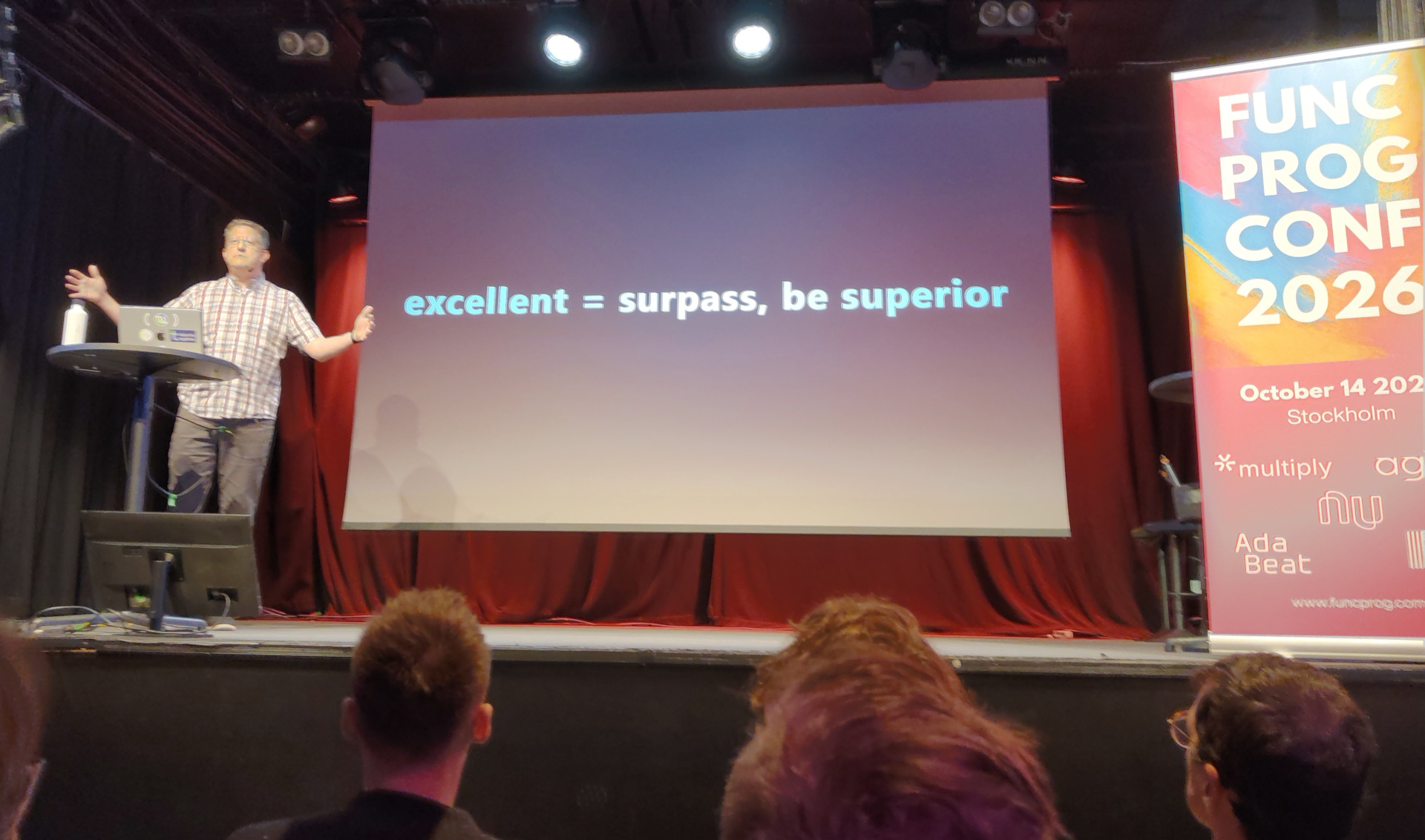 Christoph presents a slide labelled "excellent = surpass, be superior"