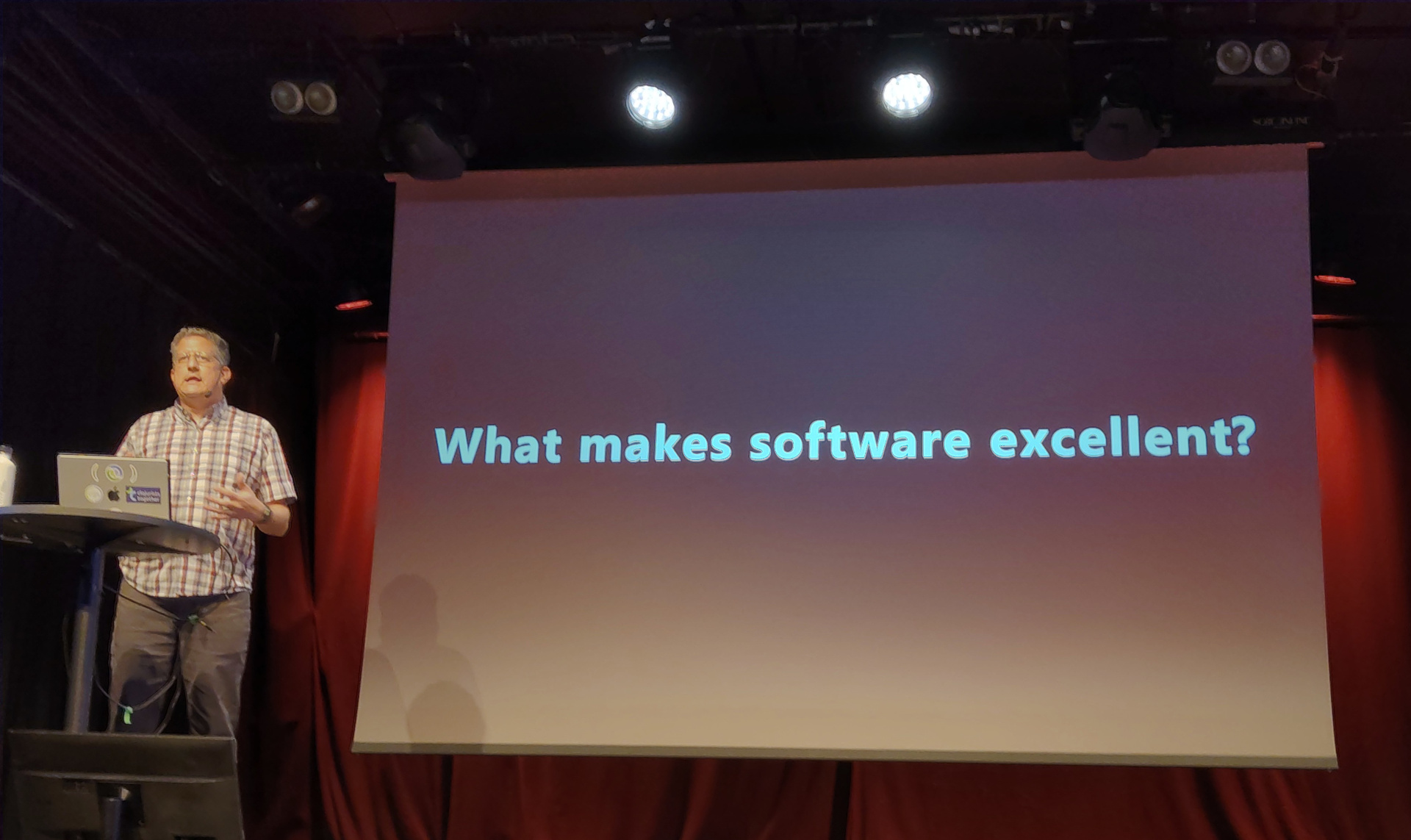 Christoph presents a slide labelled "What makes software excellent?"