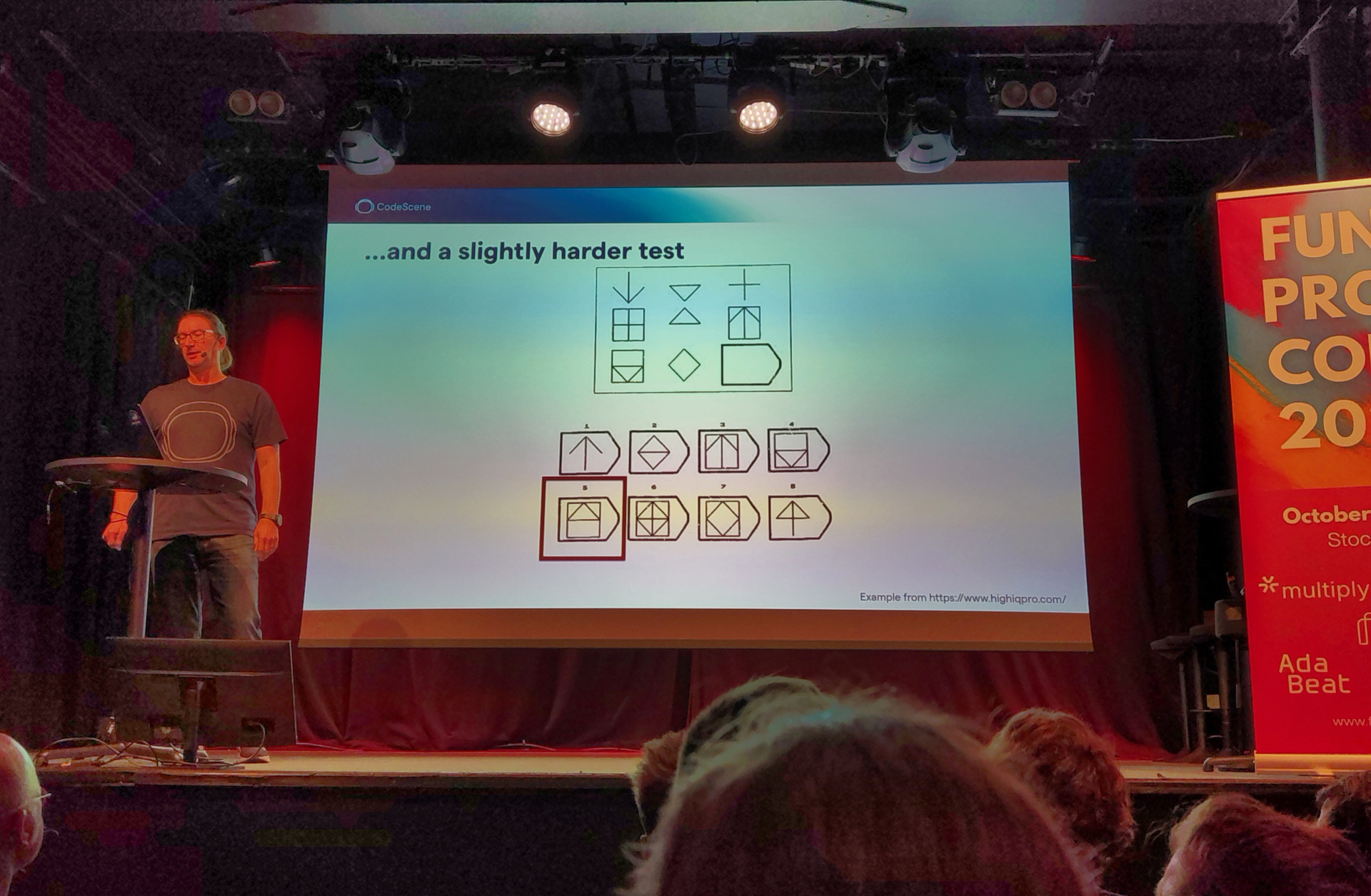 Adam presents a slide labelled "...and a slightly harder test"