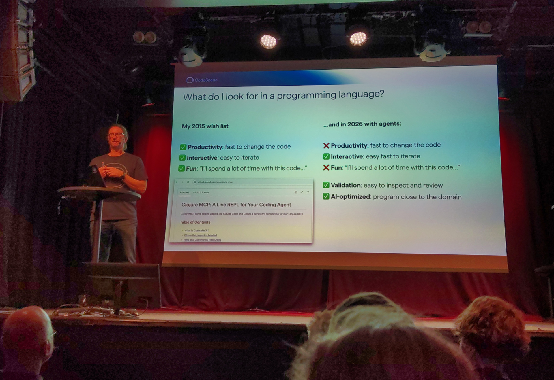 Adam presents a slide labelled "What do I look for in a programming language?"
