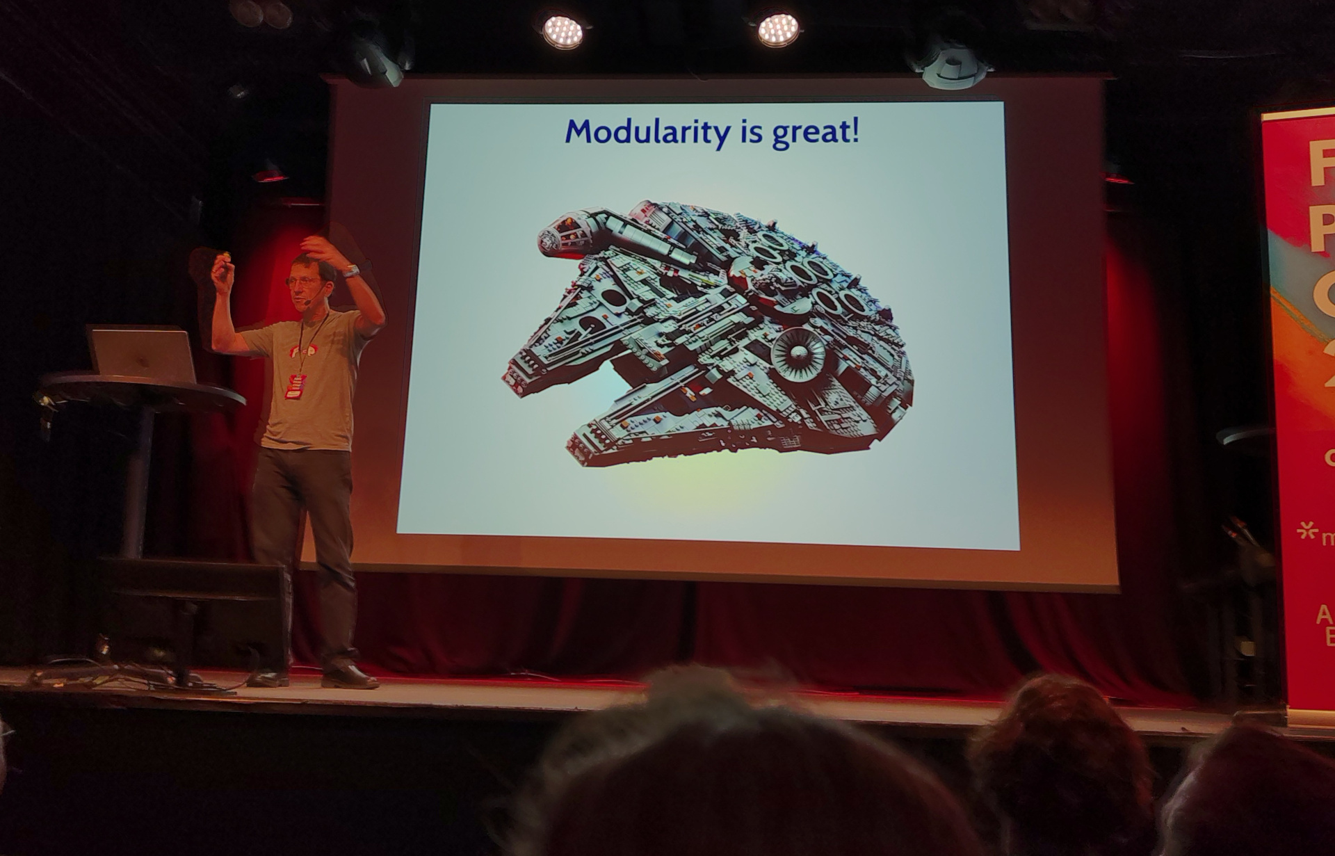 Eric presents a slide labelled "Modularity is great!"