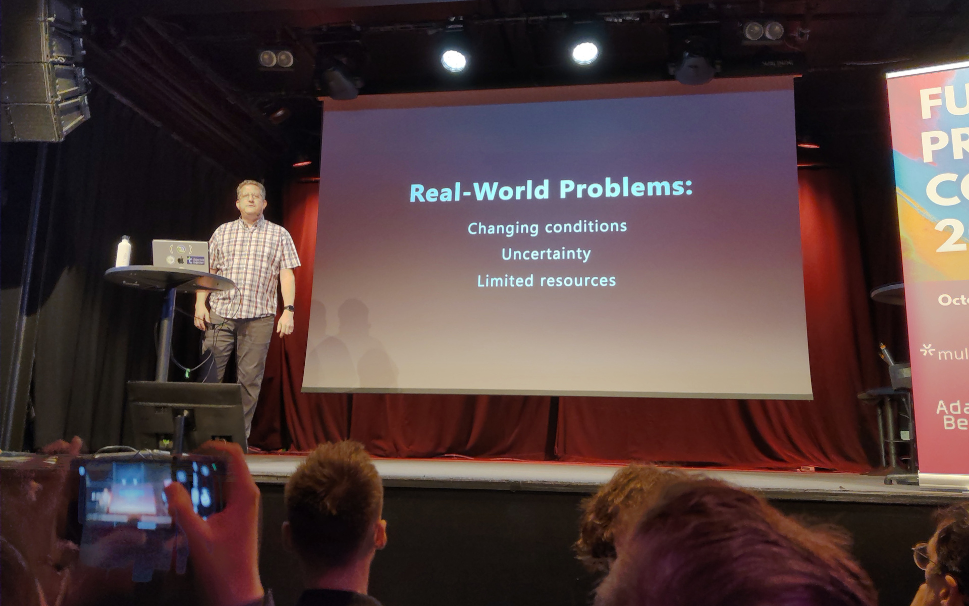 Christoph presents a slide labelled "Real-World Problems"